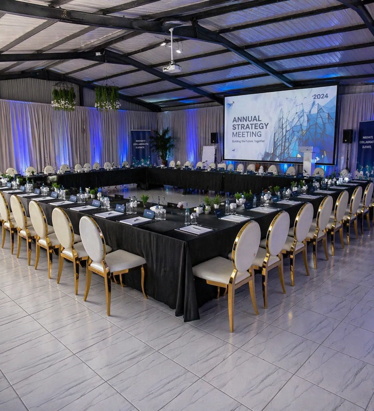 Corporate strategy meeting setup with a presentation screen and elegantly arranged tables